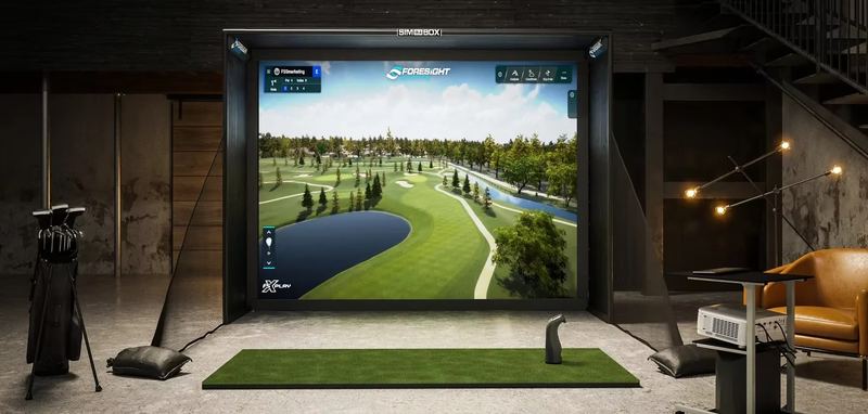 Example build style: compact golf simulator bay set up for a camera-based launch monitor, with even lighting and a clean hitting area