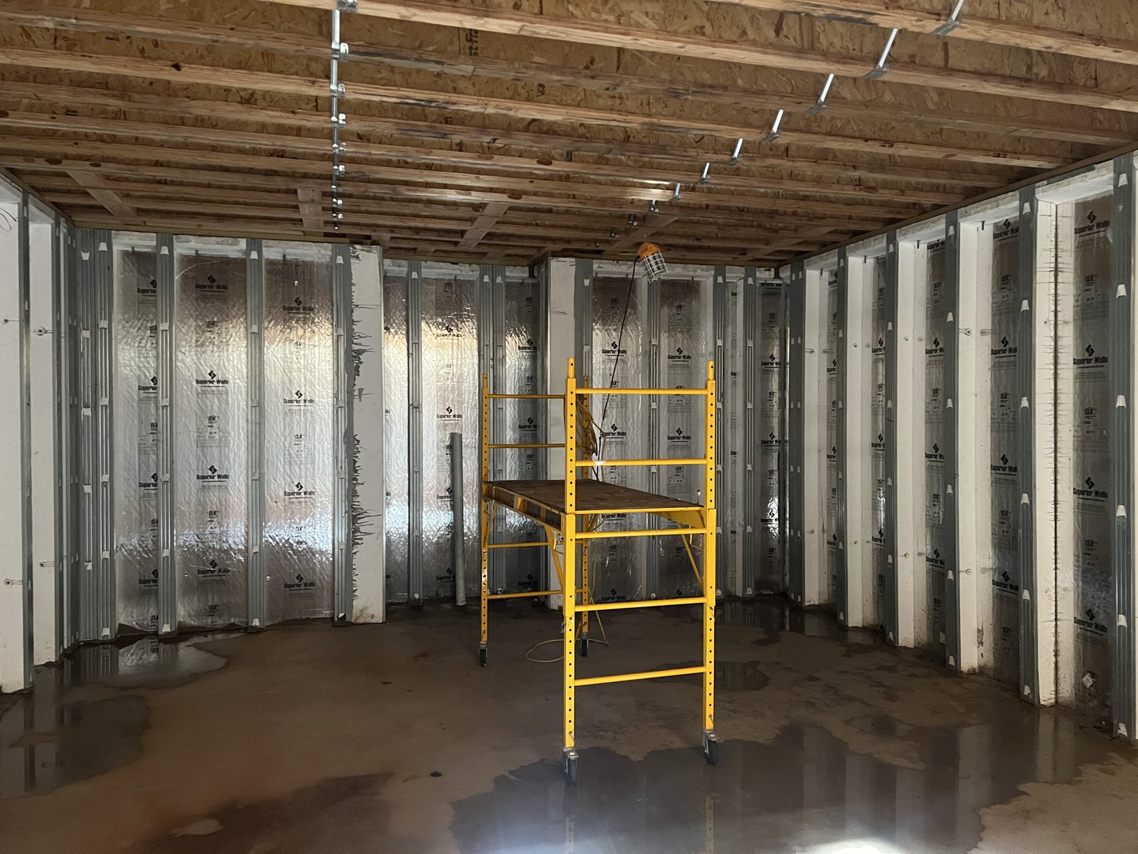 Golf simulator room during framing and insulation work
